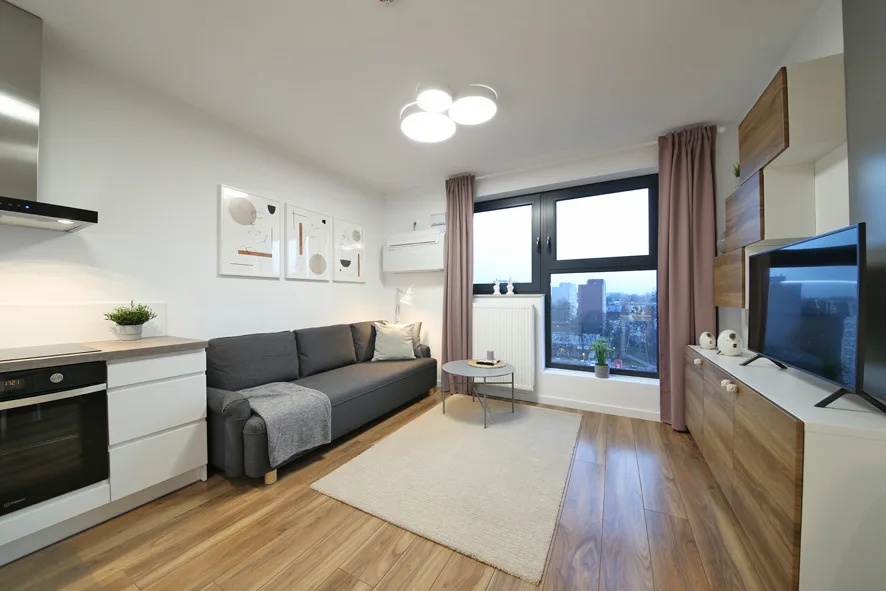 Nowoczesny apartament na wynajem we Wrocławiu — salon z aneksem kuchennym